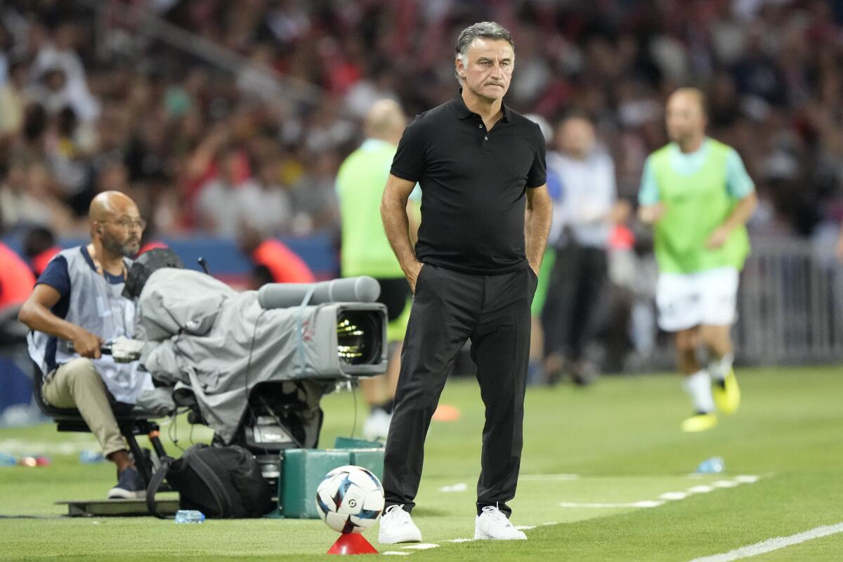 PSG's coach Christophe Galtier watches from the touchline during the French League One soccer match between Paris Saint-Germain and Montpellier at the Parc des Princes in Paris, Saturday, Aug. 13, 2022. (AP Photo/Francois Mori)