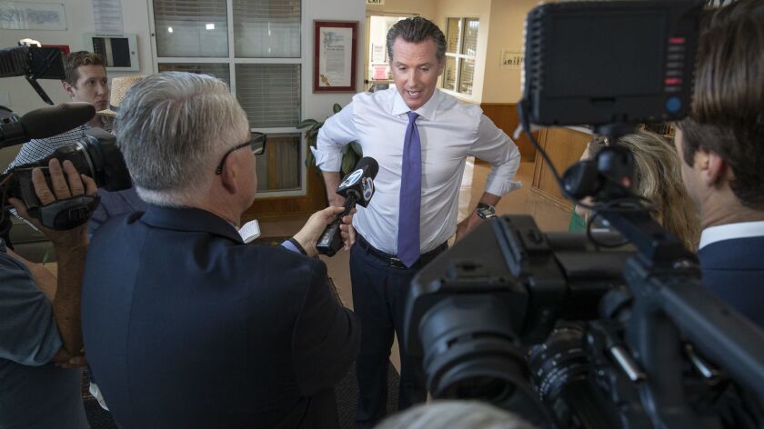Lt. Gov. and gubernatorial candidate Gavin Newsom talks with reporters prior to visiting with children at the UCLA's Early Care and Education Center in Los Angeles, Calif. on Sept. 26.