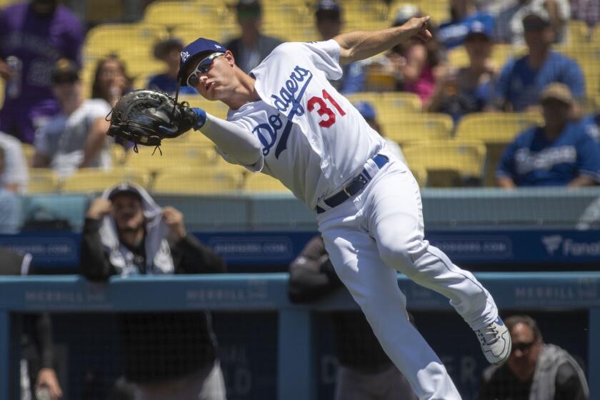 LOS ANGELES, CALIF. -- SUNDAY, JUNE 23, 2019: Dodgers first baseman Joc Pederson reaches to catch Rockies? Brendan Rodgers? pop fly in the second inning at Dodger Stadium in Los Angeles, Calif., on June 23, 2019. Dodgers won 6-3. (Allen J. Schaben / Los Angeles Times)