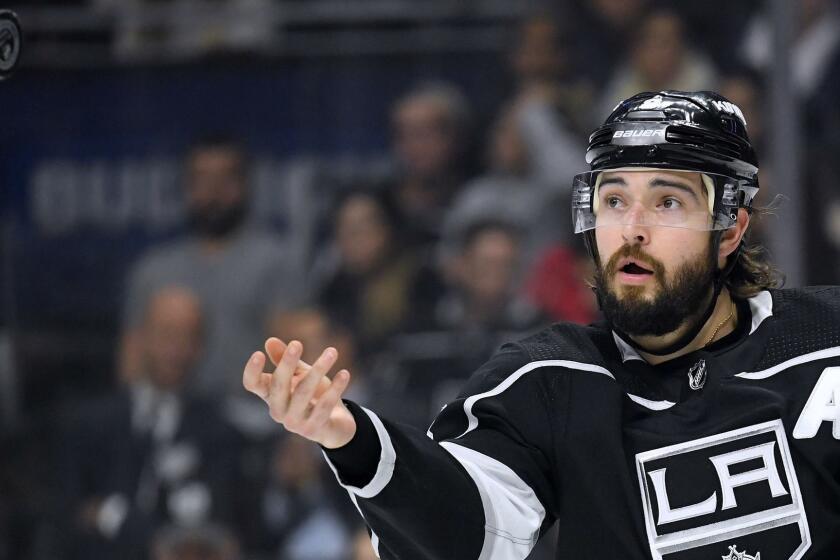 LOS ANGELES, CA - DECEMBER 04: Drew Doughty #8 of the Los Angeles Kings tosses a puck back to a linesman for a faceoff during the first period against the Arizona Coyotes at Staples Center on December 4, 2018 in Los Angeles, California. (Photo by Harry How/Getty Images) ** OUTS - ELSENT, FPG, CM - OUTS * NM, PH, VA if sourced by CT, LA or MoD **