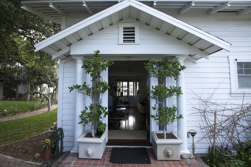 A covered front porch at Tamra Fago's tiny house in Garvanza, one of Los Angeles's oldest neighborhoods. Her home is one of three recently revived historic rentals within the 3,600-square foot Dr. John Lawrence Smith property from 1886, restored by preservationist Brad Chambers in 2013.