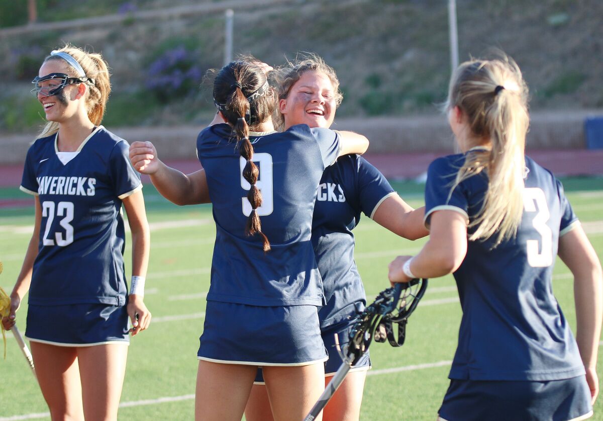 Senior Hudson Ebbers gets a big post-game hug from teammate Selena Tsai.