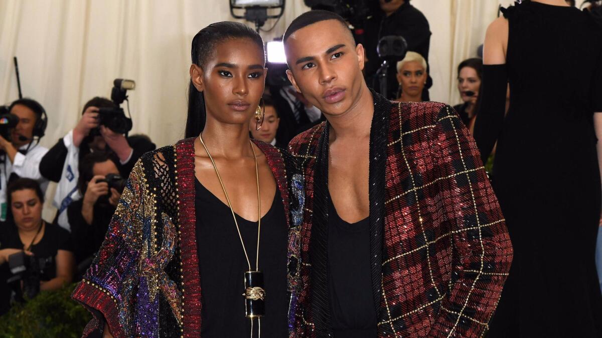Balmain's creative Olivier Rousteing, right, with Ysaunny Brito at the 2017 Met Gala, is teaming up with L’Oréal Paris to launch a capsule collection of lipstick set to launch in the fall.