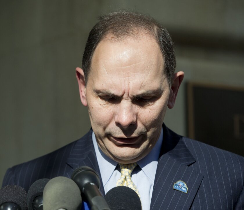 Veteran Affairs Secretary Robert A. McDonald speaks to reporters outside VA Headquarters in Washington. McDonald said integrity and character "is part of who I am" and apologized anew for erroneously claiming he served in the military's special forces.