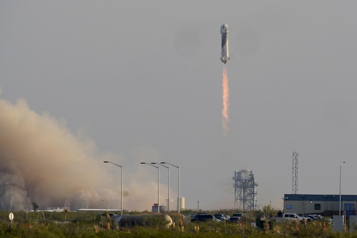 A manned New Shepard rocket lifts off from Texas in July 2021.