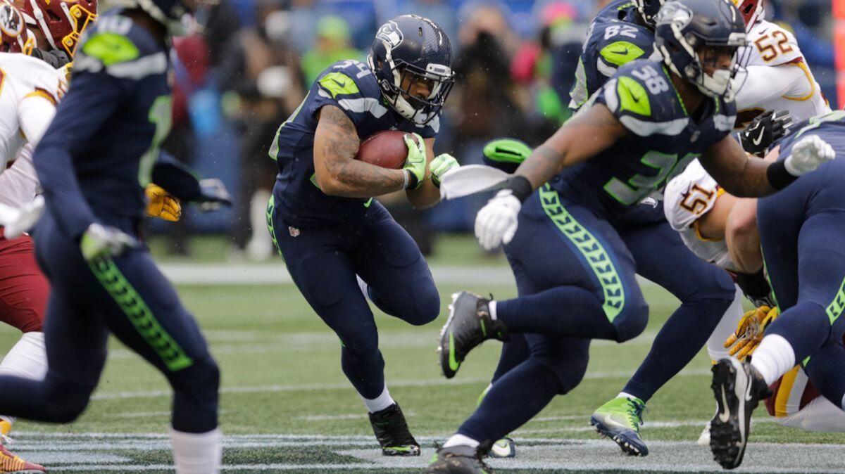 Seattle Seahawks running back Thomas Rawls carries the ball against the Washington Redskins in the first half on Sunday.