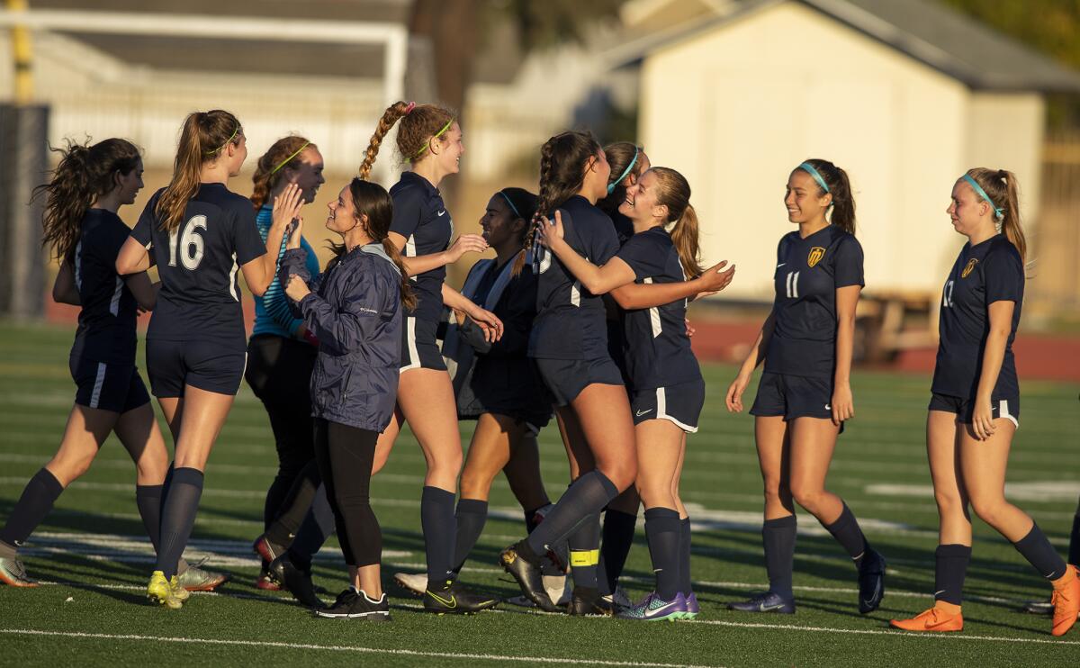 Marina celebrates a 1-0 win over Newport Harbor in a Wave League match on Tuesday in Huntington Beach.