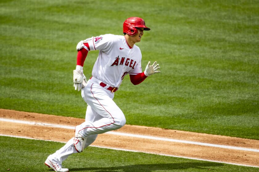 ANAHEIM, CA - APRIL 21, 2021: Los Angeles Angels designated hitter Shohei Ohtani (17) runs the bases after hitting a solo homer against Texas Rangers starting pitcher Mike Foltynewicz (20) in the 3rd inning at Angel Stadium on April 21, 2021 in Santa Ana California.(Gina Ferazzi / Los Angeles Times)
