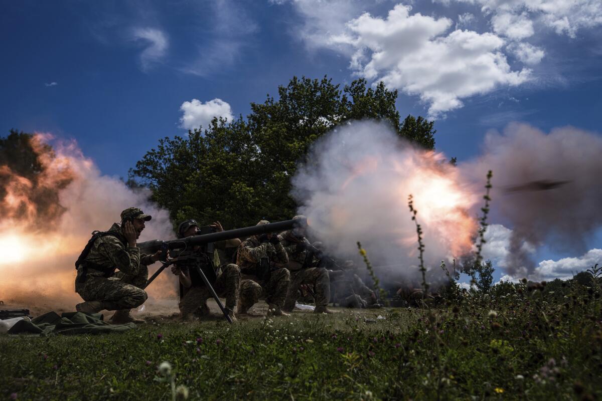 Ukrainian servicemen shooting a recoil-less gun