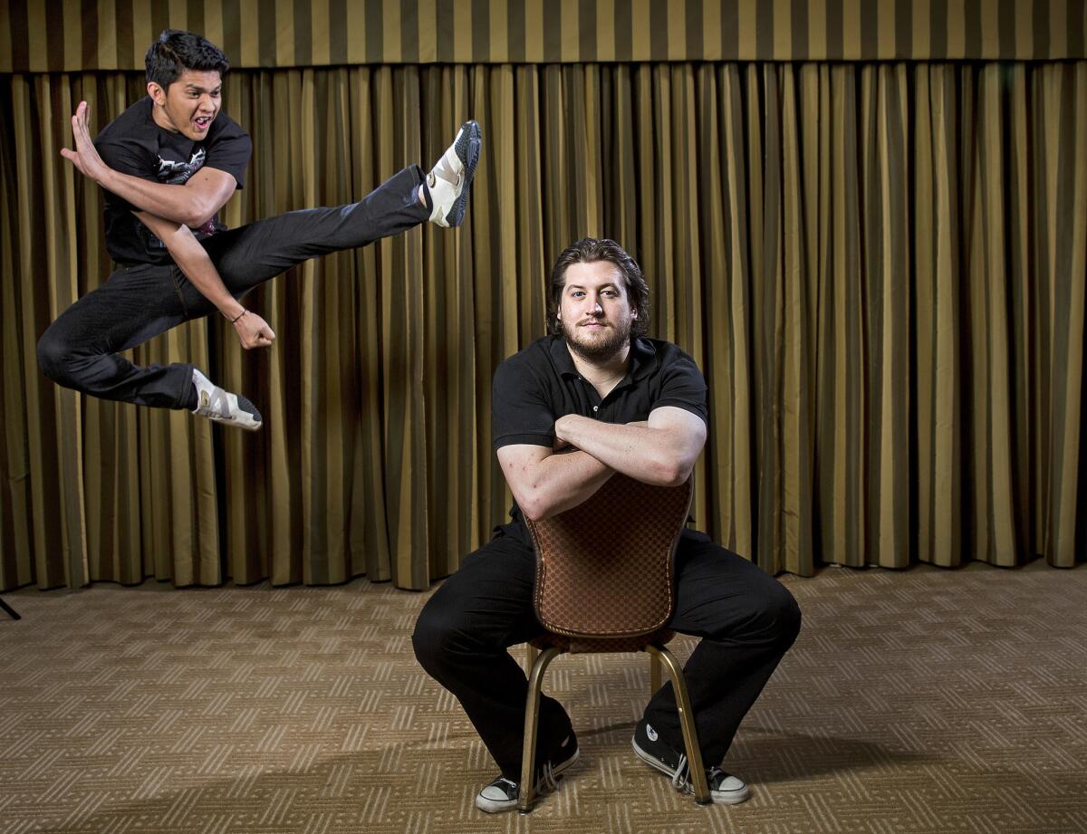 Gareth Evans, seated, director of "The Raid 2" with the film's star, Iko Uwais.