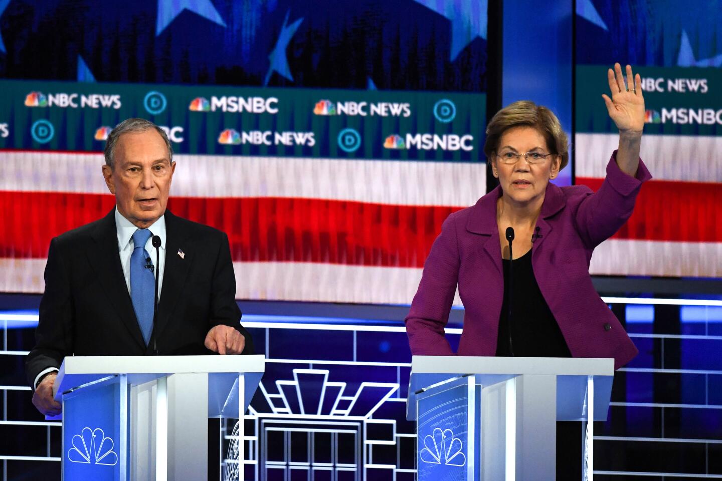 Elizabeth Warren jumps in as Michael R. Bloomberg speaks.