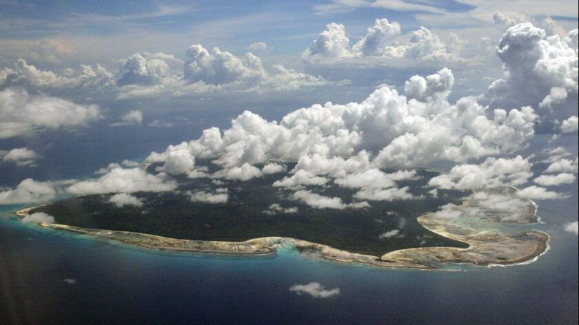 Clouds hang over the North Sentinel Island, in India's southeastern Andaman and Nicobar Islands, on Nov. 14, 2005.