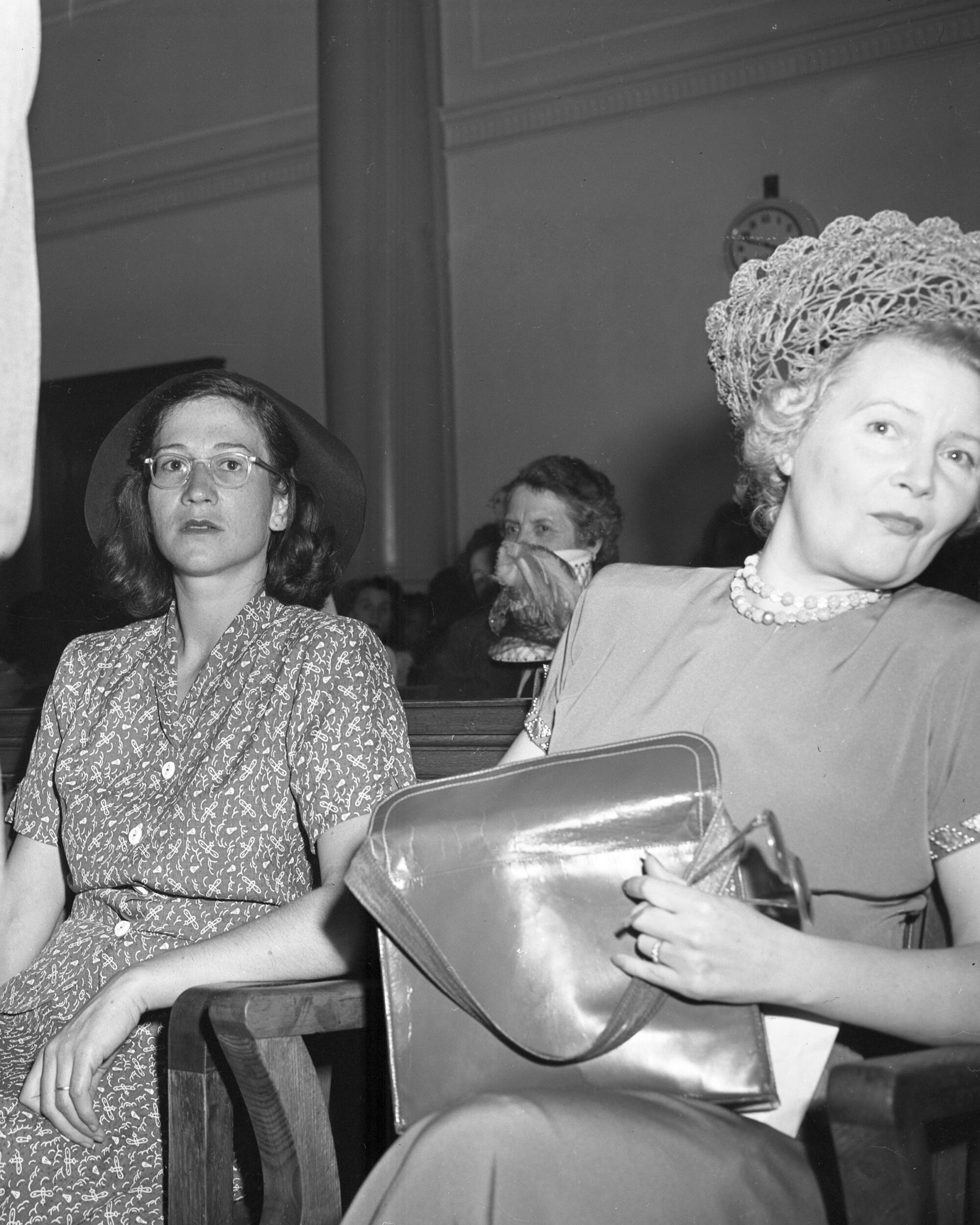 Helen Roberts sits in court next to an unidentified woman 