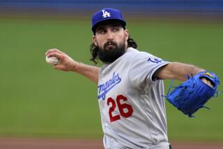Los Angeles Dodgers starting pitcher Tony Gonsolin delivers during the first inning.