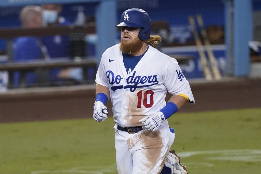 The Dodgers' Justin Turner rounds the bases after homering during the third inning Sept. 25, 2020.