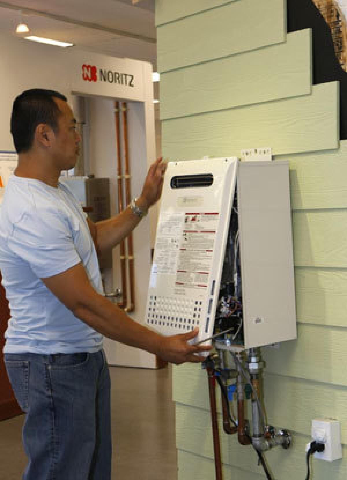 Before installing a tankless water heater like the one above, consider the specifications of home and machine