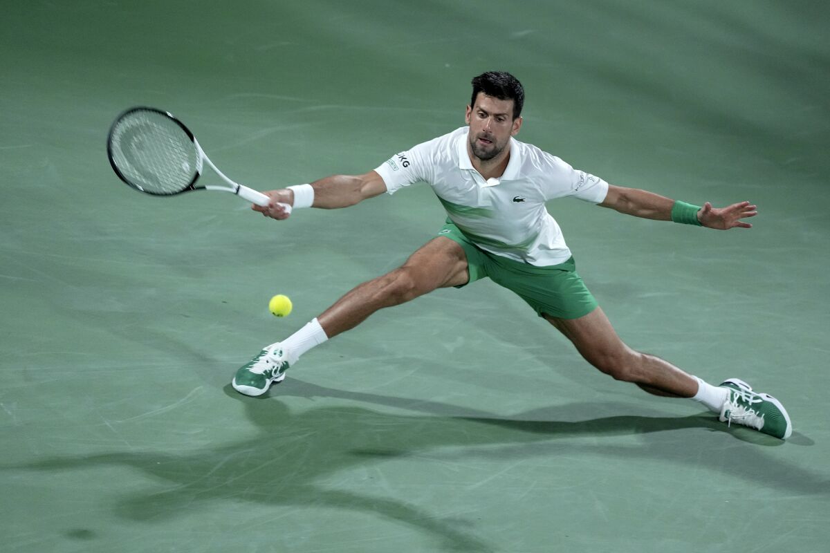 Serbia's Novak Djokovic returns the ball to Czech Republic's Jiri Vesely during a match Feb. 24 in Dubai.