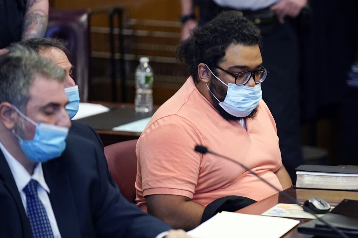 FILE — Richard Rojas, right, appears in court for the start of his trial in New York, Monday, May 9, 2022. Rojas, 31, is fighting murder, assault and other charges at a trial unfolding in the shadow of mass shootings across the country and the political debate in which gun-control opponents have sought to blame the violence on failures in mental health care. (AP Photo/Seth Wenig, File)