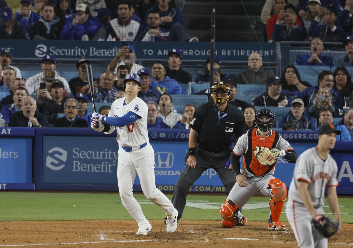 Dodgers star Shohei Ohtani hits a home run against the San Francisco Giants.