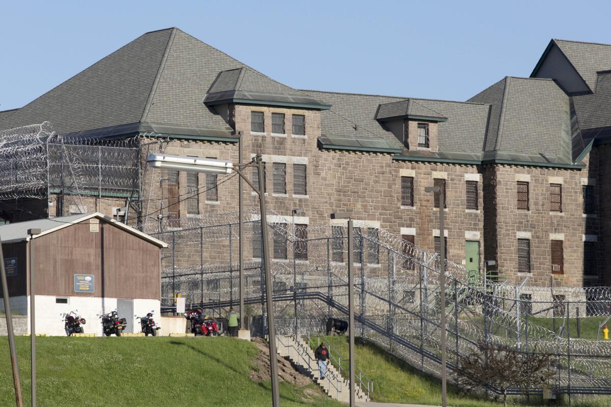An employee is shown on June 17 leaving the Clinton Correctional Facility in Dannemora, N.Y. Murderers Richard Matt and David Sweat were discovered missing from the facility June 6.