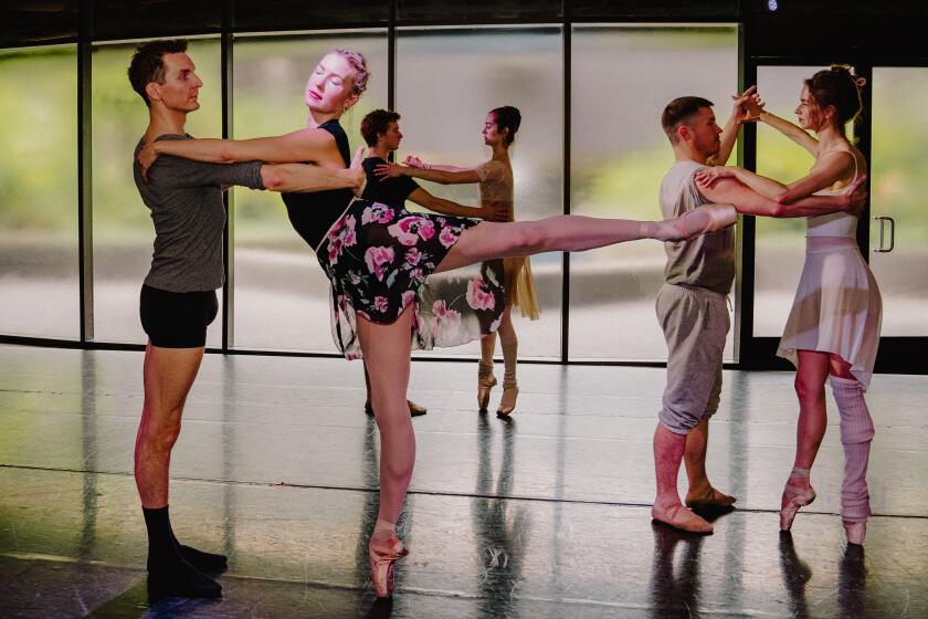 Ballet dancers rehearsing in the studio.