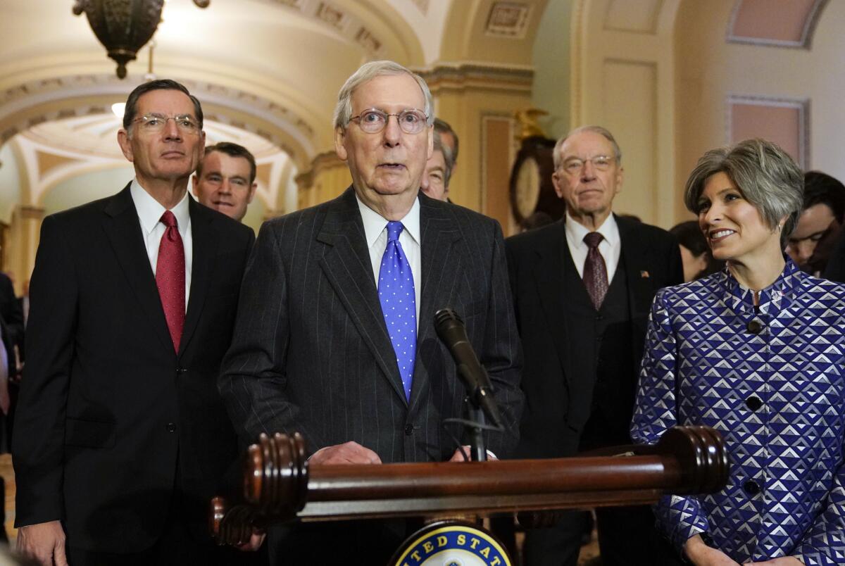 Senate Majority Leader Mitch McConnell (R-Ky.), center, joined by other GOP senators, speaks to reporters in the Capitol on Wednesday.