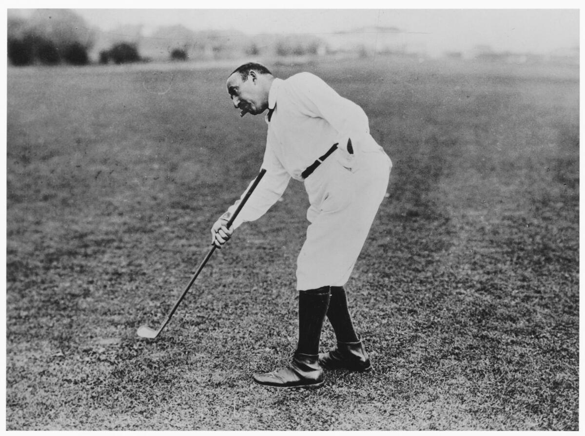 Undated photo of William Fox golfing.