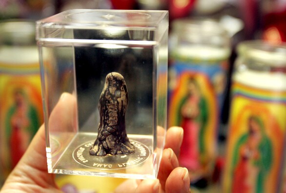 Workers at Martucci Angiano's gourmet chocolate company, Bodega Chocolates, in Fountain Valley discovered under a vat a 2-inch-tall column of chocolate droppings that they believe bears a striking resemblance to the Virgin Mary on Aug. 18, 2006.
