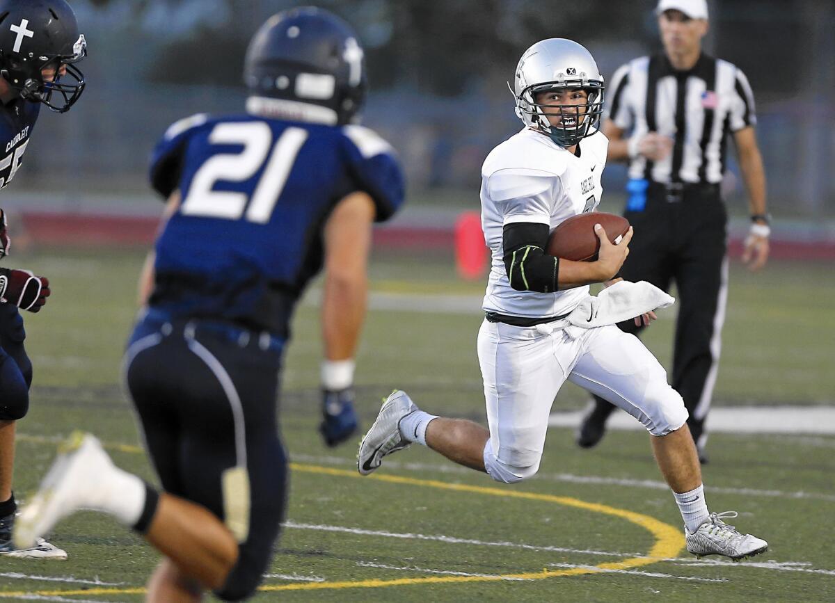 Sage Hill School quarterback Caden Sheetz runs on a keeper against Calvary Chapel on Thursday.