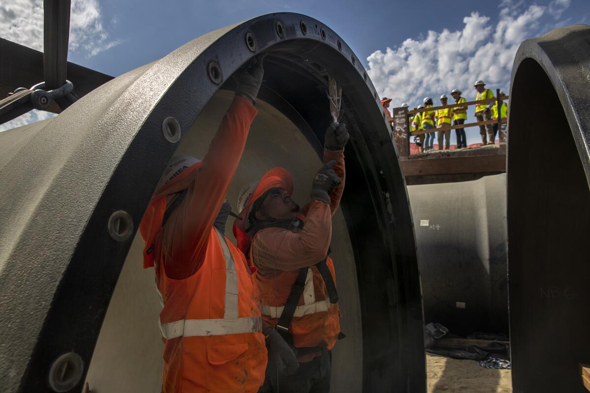 Crews install a portion of 104-inch earthquake-resistant ductile iron pipe on the Colorado River Aqueduct.