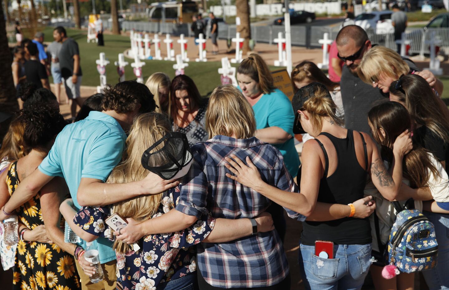 People pray at a makeshift memorial for victims of the mass shooting in Las Vegas.
