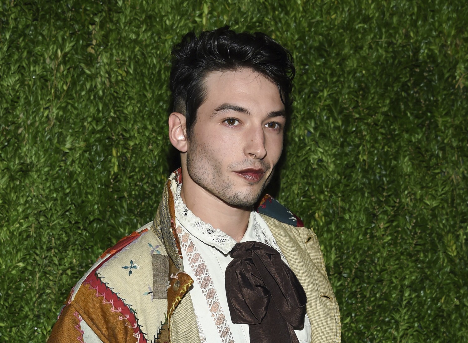 Ezra Miller charged with burglary after allegedly stealing 'several bottles of alcohol'