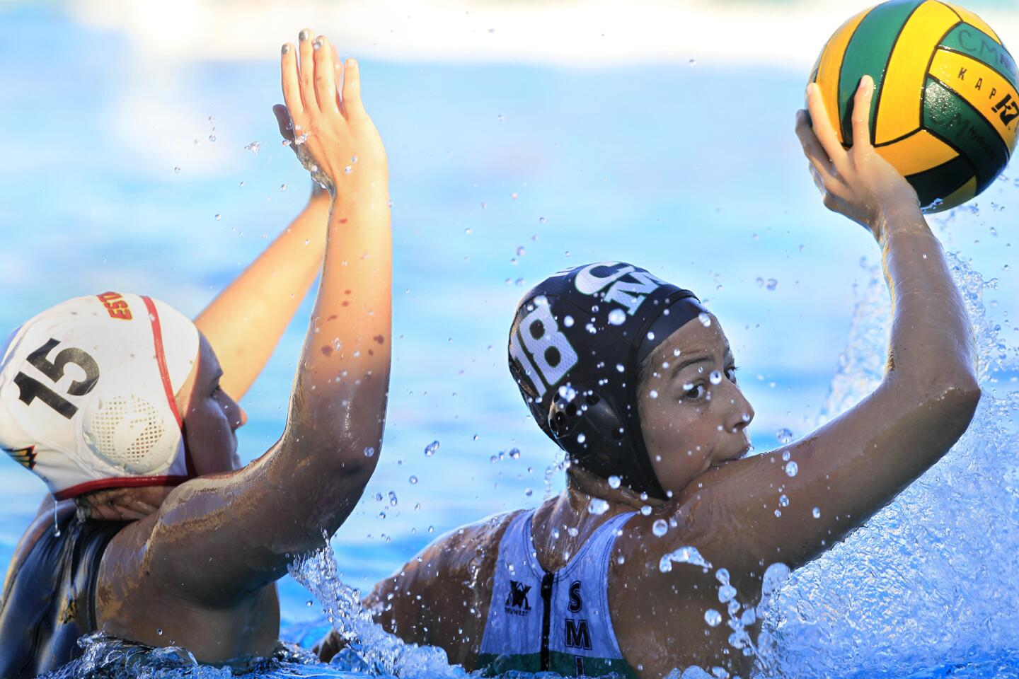 Costa Mesa High's Lauren Smith (18) competes against Estancia's Nikkie Blinn (15) during the first half in an Orange Coast League game on Wednesday.