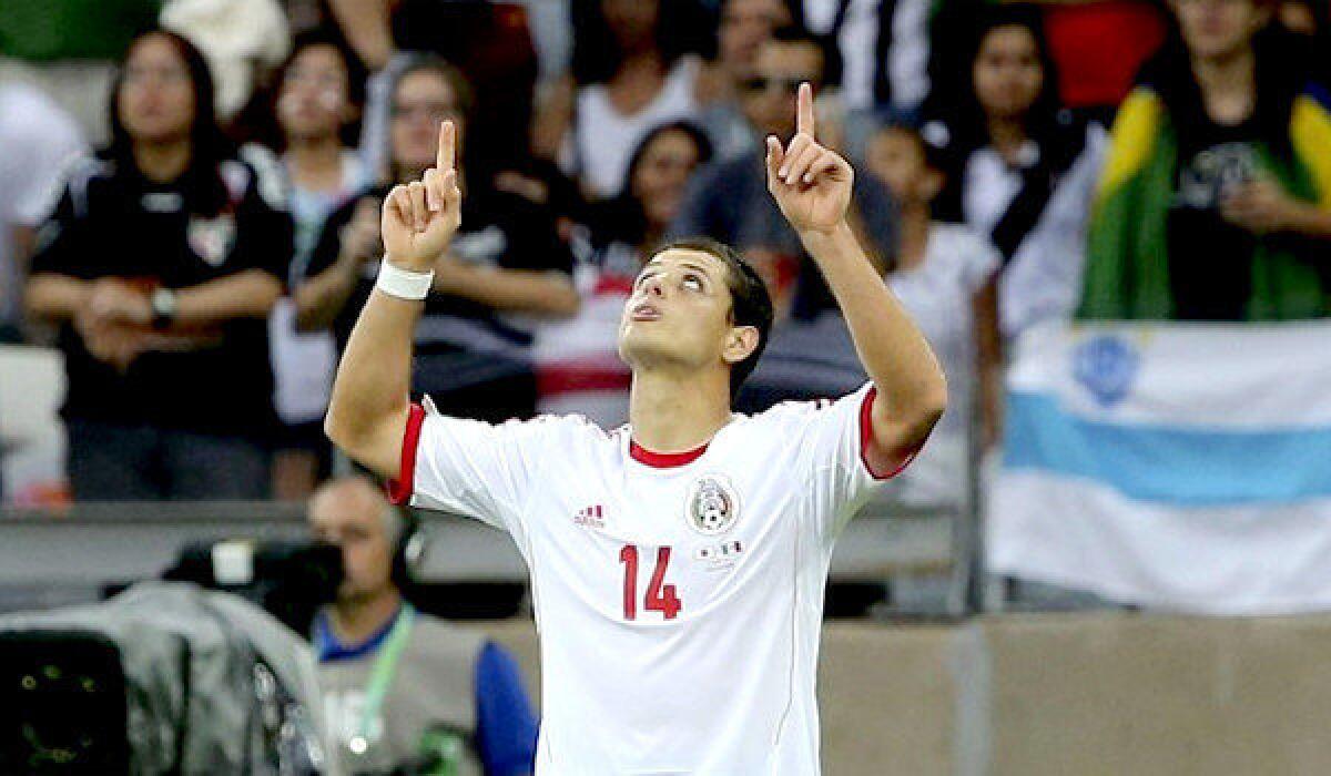 Mexico's Javier "Chicharito" Hernandez points to the sky after scoring his first of two goals against the Japan team during their FIFA Confederations Cup matchup on Saturday.