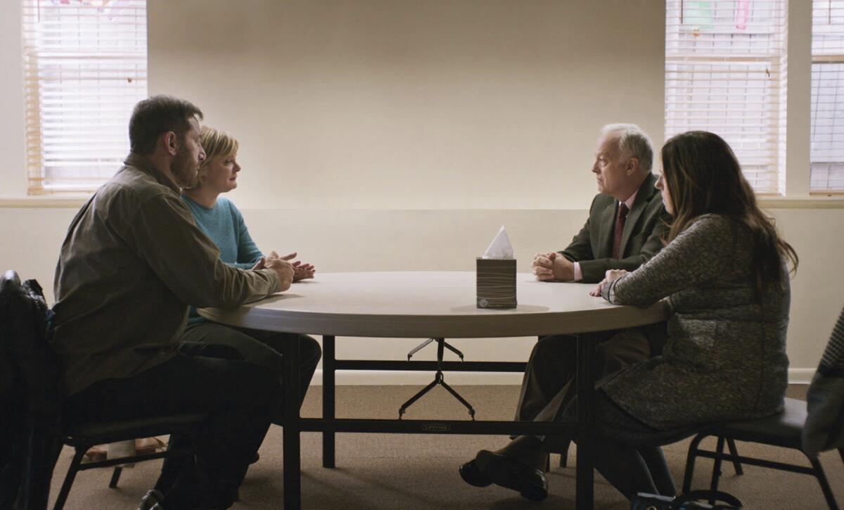 This image released by Bleecker Street shows, from left, Jason Isaacs, Martha Plimpton, Reed Birney and Ann Dowd in a scene from "Mass." (Bleecker STreet via AP)