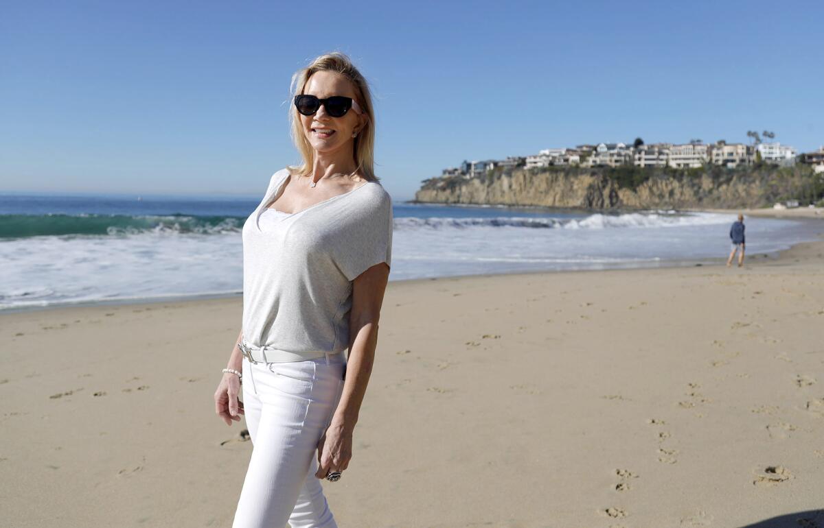 Karen Pierce walks Emerald Bay in Laguna Beach. 
