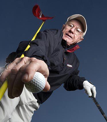 James L. Malone III, the 2007 Golf Nut of the Year, picks up a ball at the Farmington Country Club in Charlottesville, Va., in early February. He retired in 2006, at age 58, with enough free time and resources to pursue his hobby like few others.