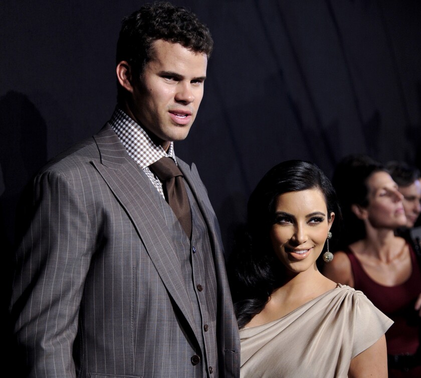 Kris Humphries and Kim Kardashian in 2011, just two months before the bride would file for divorce from her hoopster husband.