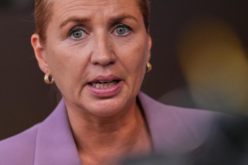 FILE - Denmark's Prime Minister Mette Frederiksen talks to journalists as she arrives for the EU summit in Brussels, Thursday, June 18, 2026. (AP Photo/Marius Burgelman, File)