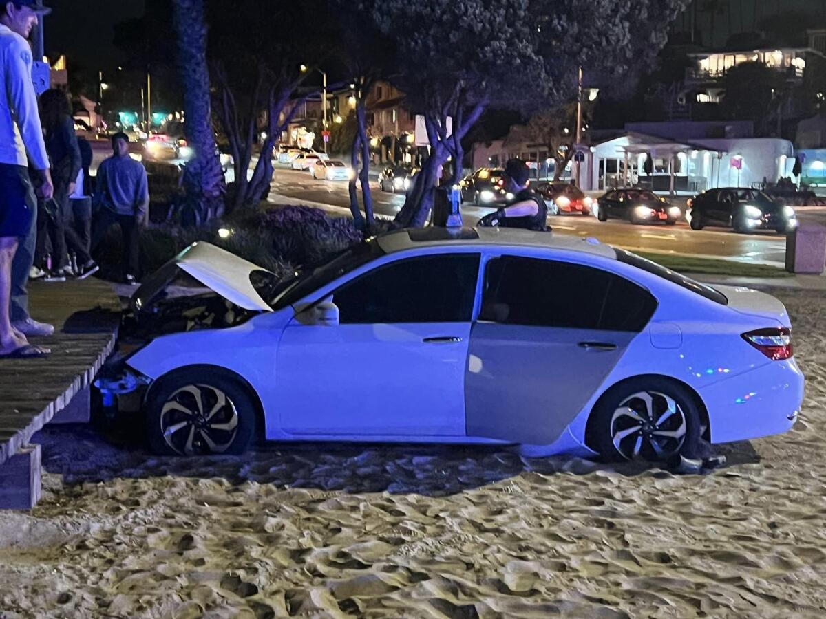 The driver of a sedan that crashed into the boardwalk at Main Beach Wednesday evening was arrested on suspicion of DUI.