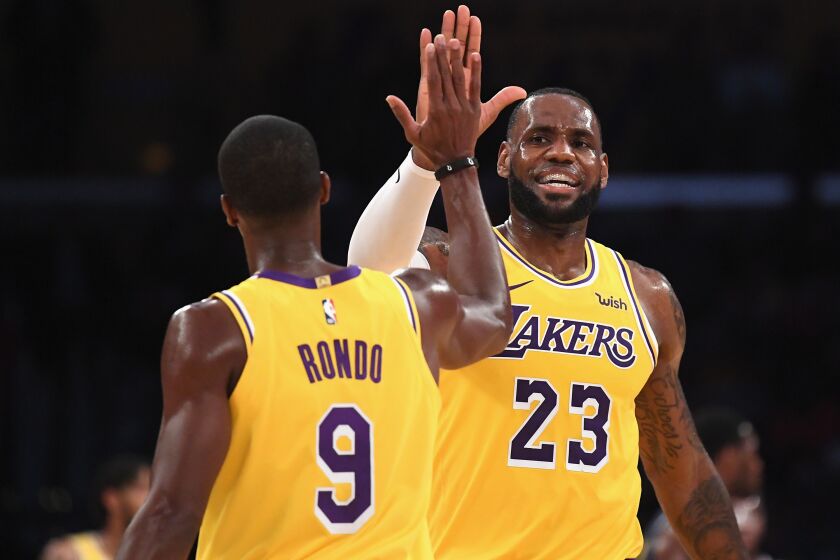LOS ANGELES, CA - OCTOBER 02: LeBron James #23 of the Los Angeles Lakers high fives Rajon Rondo #9 during a preseason game against the Denver Nuggets at Staples Center on October 2, 2018 in Los Angeles, California. (Photo by Harry How/Getty Images)