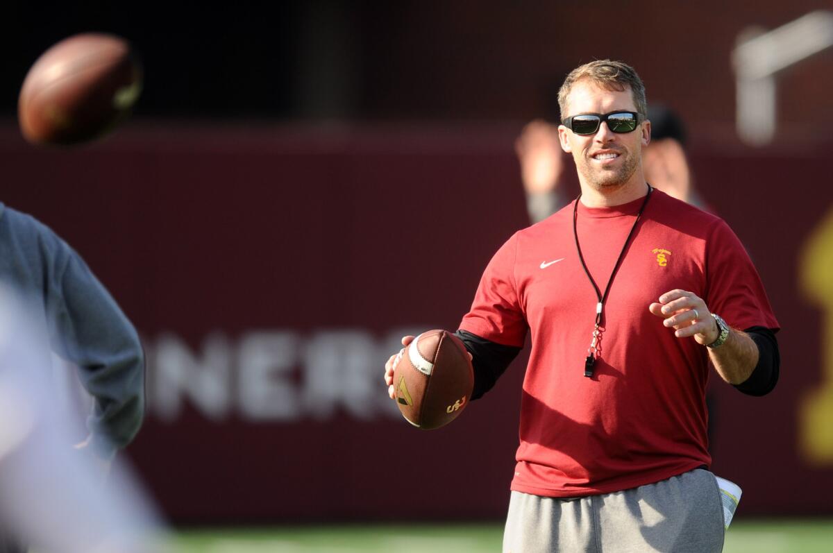 Temporary USC defensive coodinator Peter Sirmon helps conduct practice in preparation for their bowl game.