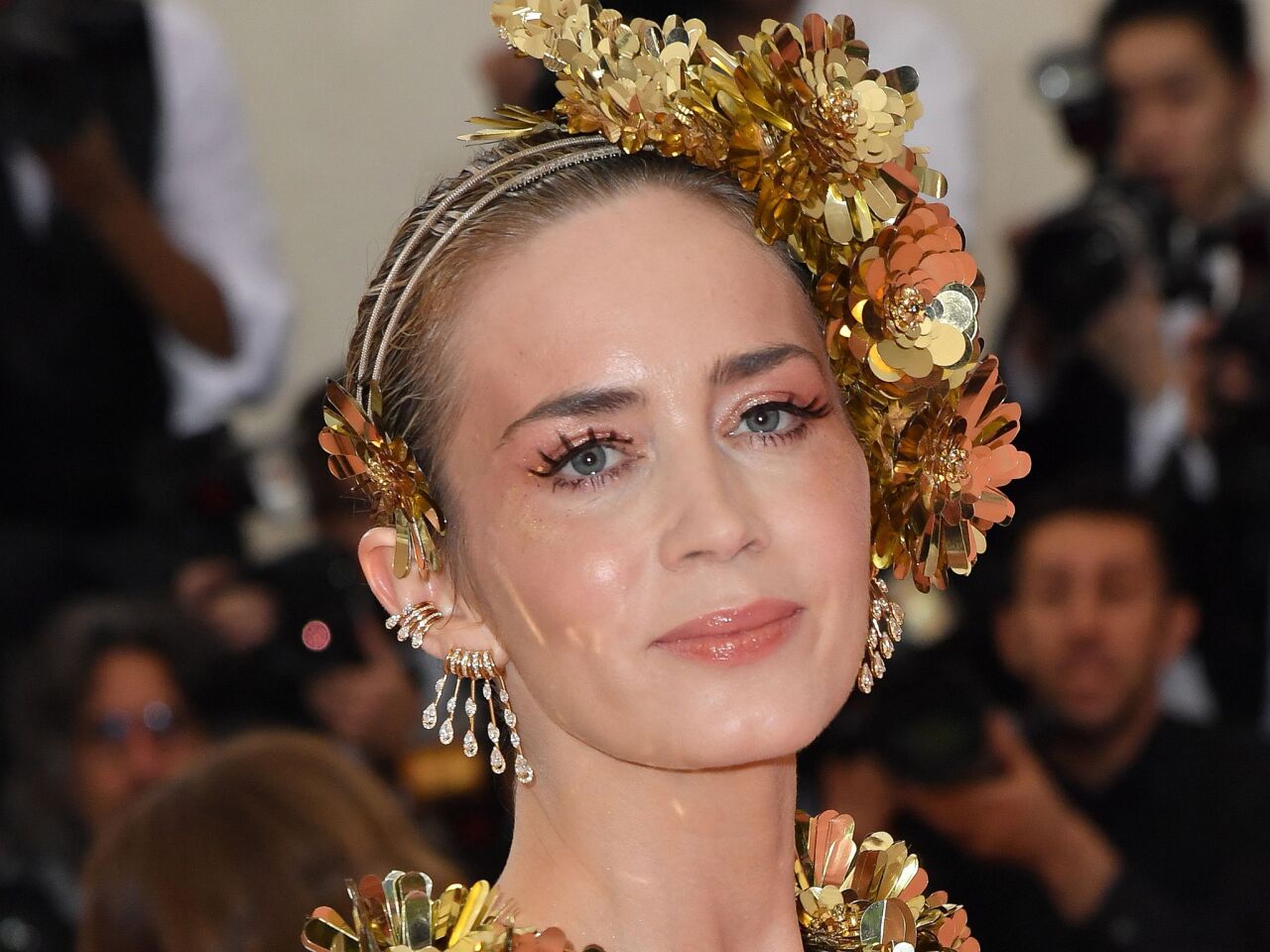Emily Blunt's Met Gala makeup — a shiny lip and relatively subtle glittery gold highlights — are inspiration for those wanting to inject a little camp into their everyday look.