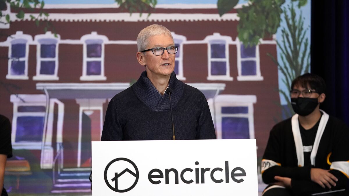 Apple's CEO Tim Cook speaks during a news conference Wednesday, Oct. 13, 2021, in Salt Lake City. Cook and NBA All-Star Dwyane Wade joined Utah leaders to announce the completion of a local advocacy group's campaign to build eight new homes for LGBTQ youth in the U.S. West. (AP Photo/Rick Bowmer)