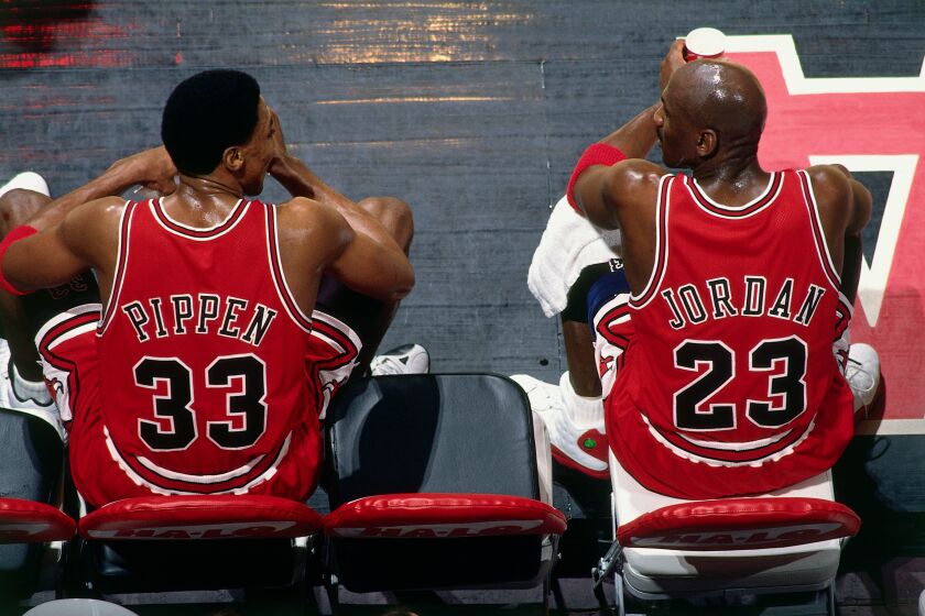A photographed featured in "The Last Dance." VANCOUVER, BC - JANUARY 27: Scottie Pippen #33 and Michael Jordan #23 of the Chicago Bulls sit on the bench during the game against the Vancouver Grizzlies at General Motors Place on January 27, 1998 in Vancouver, British Columbia, Canada. NOTE TO USER: User expressly acknowledges and agrees that, by downloading and or using this photograph, User is consenting to the terms and conditions of the Getty Images License Agreement. Mandatory Copyright Notice: Copyright 1998 NBAE (Photo by Andy Hayt/NBAE via Getty Images)
