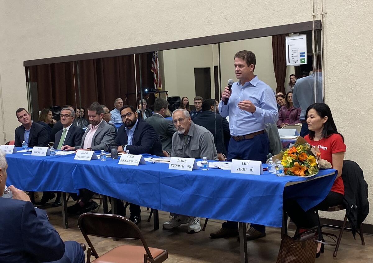 Seven candidates for City Council District 1 — Aaron Brennan, Joe LaCava, Will Moore, Harid Puentes, Louis Rodolico, James Rudolph and Lily Zhou — state their cases at the Nov. 14 La Jolla Town Council meeting.