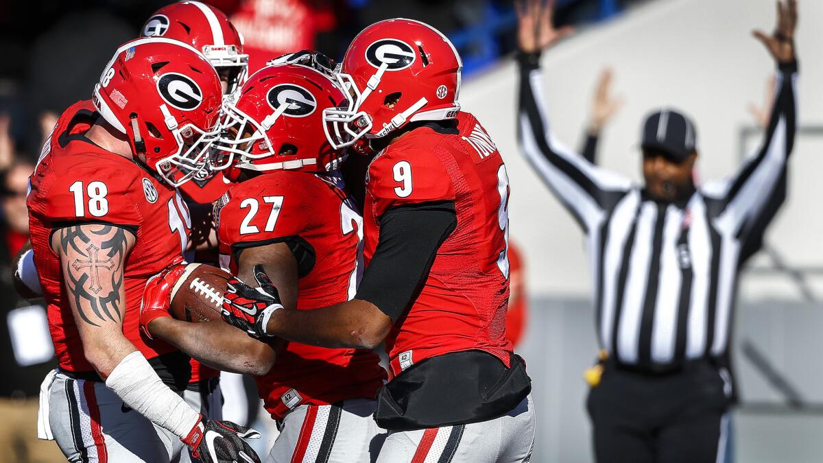 Georgia running back Nick Chubb (27) celebrates with teammates after scoring a touchdown against TCU during the fourth quarter Friday.