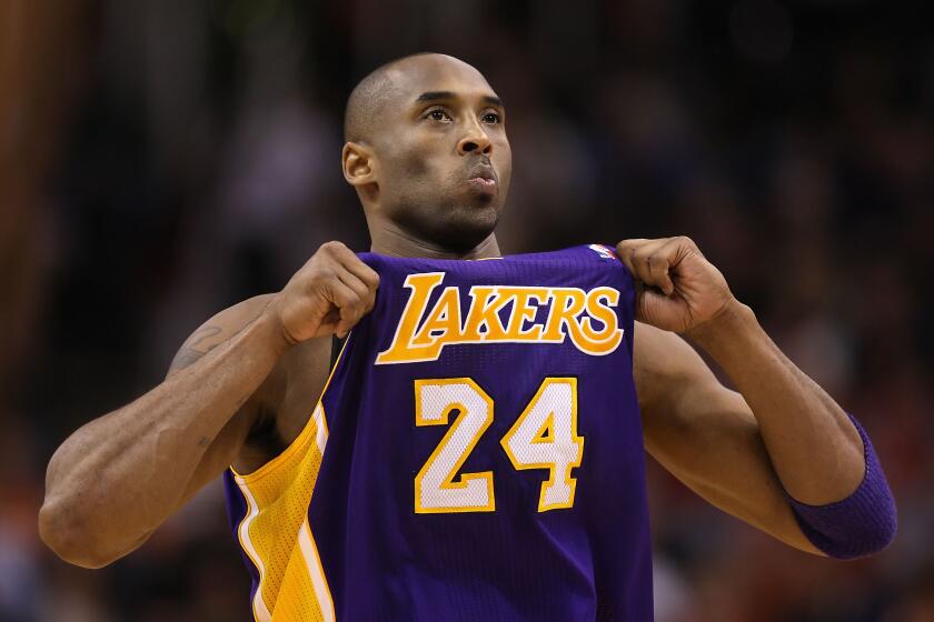 PHOENIX, AZ - FEBRUARY 19: Kobe Bryant #24 of the Los Angeles Lakers adjusts his jersey during the NBA game against the Phoenix Suns at US Airways Center on February 19, 2012 in Phoenix, Arizona. The Suns defeated the Lakers 102-90. NOTE TO USER: User expressly acknowledges and agrees that, by downloading and or using this photograph, User is consenting to the terms and conditions of the Getty Images License Agreement. (Photo by Christian Petersen/Getty Images)