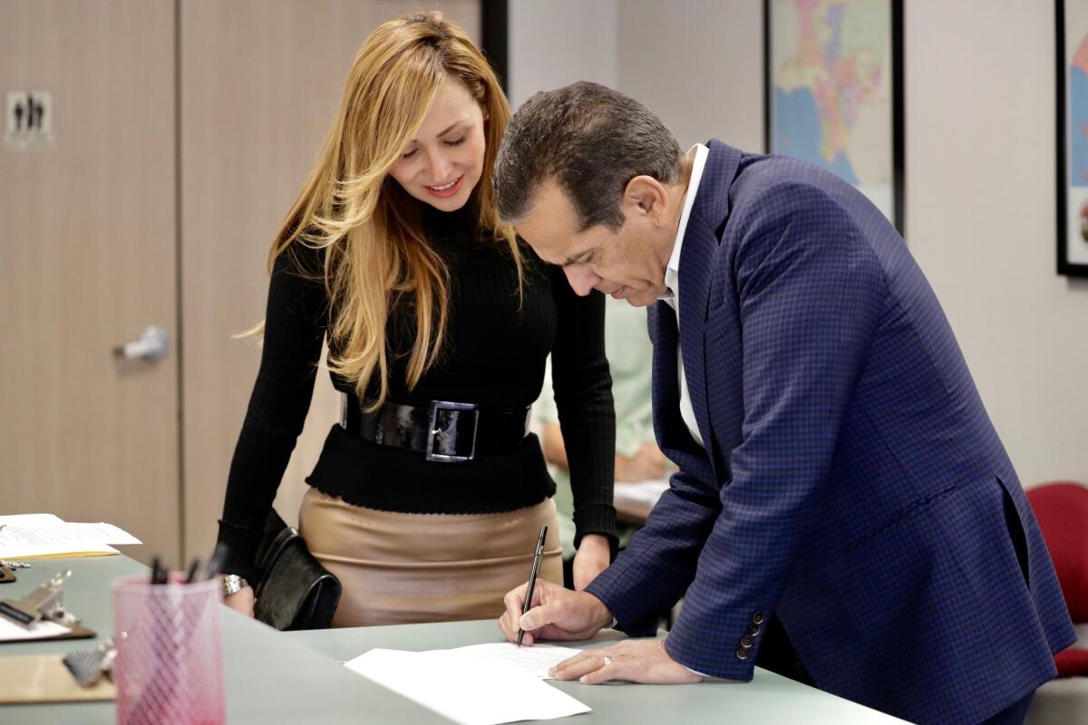 Antonio Villaraigosa, accompanied by his wife, Patty, officially files to run for governor in Norwalk Thursday