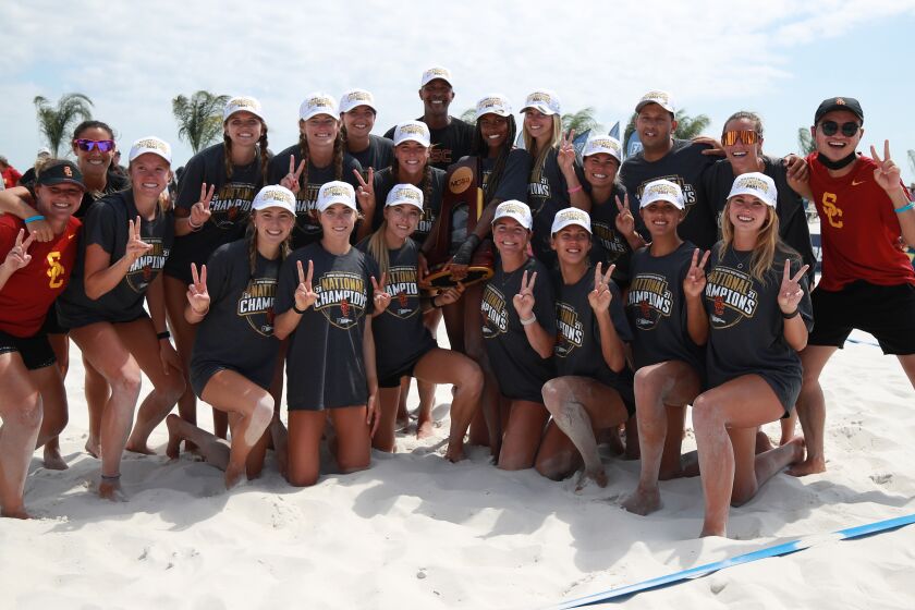 USC players celebrate after winning the NCAA beach volleyball title.